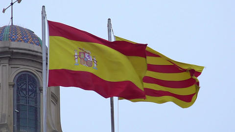 Beauty of two waving Spanish and Catalan flags, red, yellow colors, coat of arms