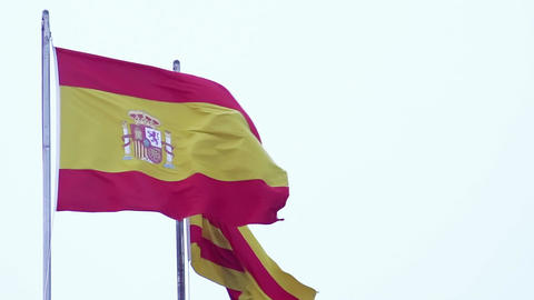 Spanish and Catalan flags waving in wind, freedom sign, nationality, patriotism