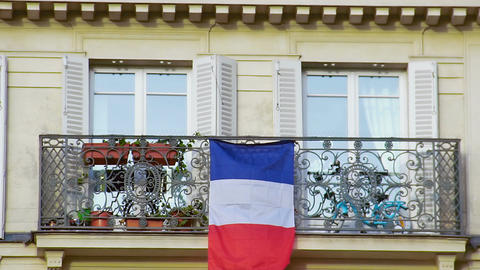 Beautiful balcony with French flag, closeup. Patriotism, love for motherland