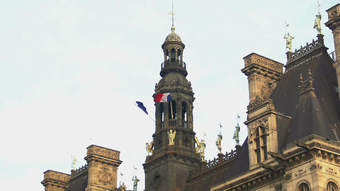 French and European Union flags hanging on antique building, tourism in France