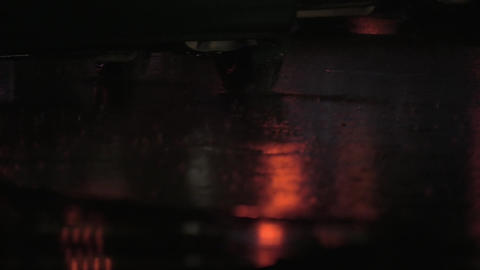 Close up view of rain road with riding car