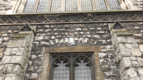 Different windows of an old and stone building