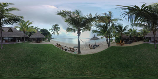 360 VR Tropical beach with house and woman in hammock using mobile, Mauritius