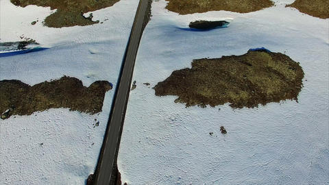 Aerial view of cars driving through mountain pass Aurlandsfjellet in Norway