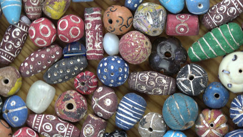 Rotating ancient decorated ceramic indian beads from Varanasi, video background