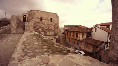 Citadel Hisar view on city boy runs on street cloudy day Ankara