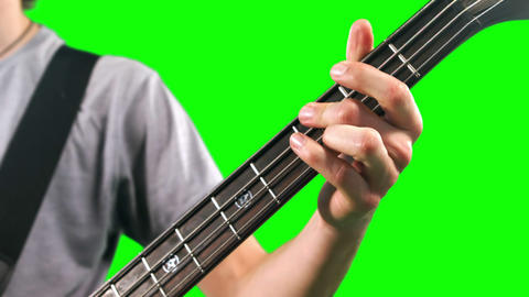Close up of man playing bass