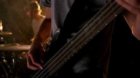 Close up of man playing the bass