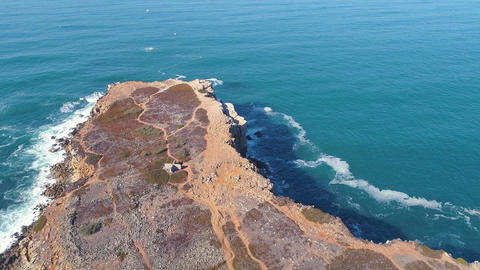 Aerial View Seascape with Waves on Rocky Island