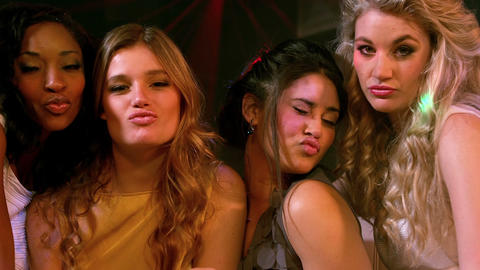 Group of friends doing duck face at the camera