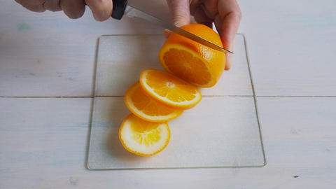 cutting fresh orange
