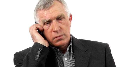 Businessman talking on his mobile phone. Isolated on white background