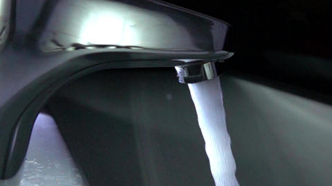 Water tap in action. Super slow motion close up shot, 1000 fps