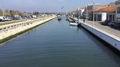 Tourists on Moliceiro traditional canal boats in Aveiro Portugal