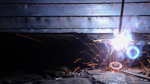 Welder working in industry with welding machine