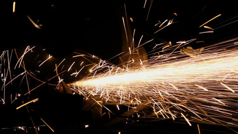 The grinding wheel contact with the iron causes sparks with sound