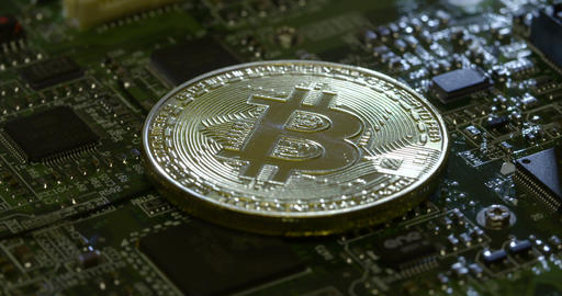 Rotating shot of a casascius bitcoin on a circuit board