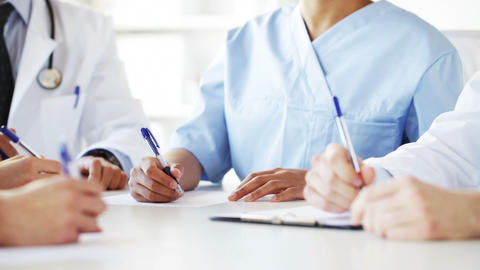 group of doctors at meeting in hospital