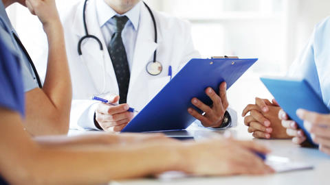 group of doctors at meeting in hospital
