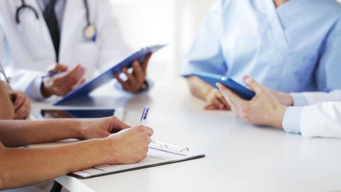 group of doctors at meeting in hospital