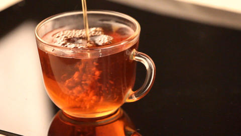 Pour in Cup of hot tea