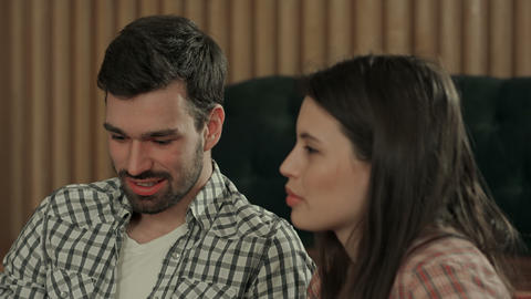 Young couple talking in coffee shop