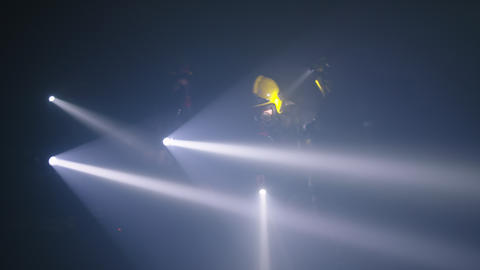 Rescue forces search for survivers inside a dark tunnel using flashlights