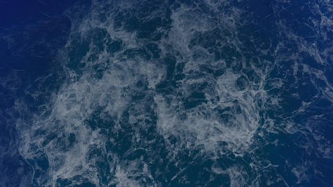 Stormy Sea at Night with Rain and lighting flashes in the middle of the ocean