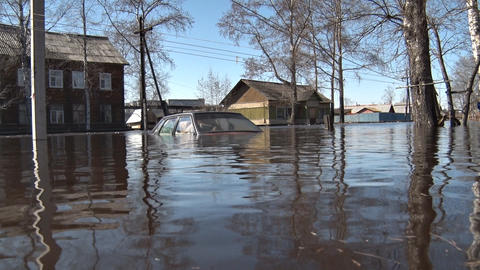 Car was flooded with water during spring flooding in village