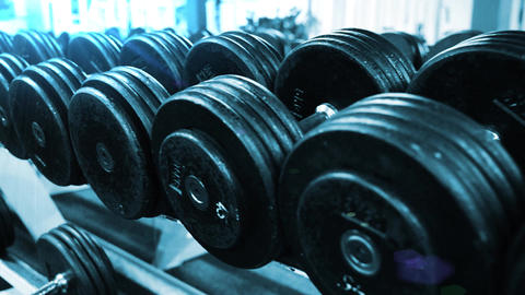 close up gym dumbbells fitness center sport