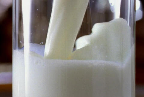 Glass filling with milk 35mm