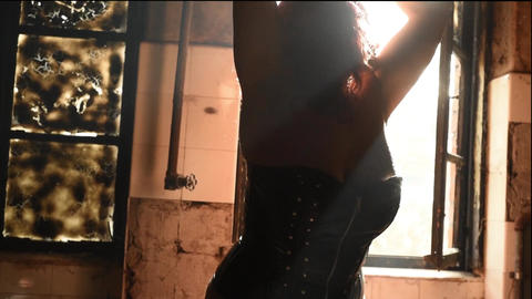 woman posing in front of old window backlit female nude model