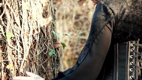 Beautyful Viking woman conjures a tree and nature
