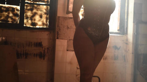 woman posing in front of old window backlit female nude model