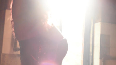 woman posing in front of old window backlit female nude model