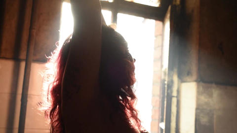 woman posing in front of old window backlit female nude model