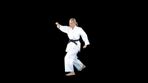 Sporty woman practising karate