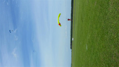 Parachute landing during air show, hd vertical shot
