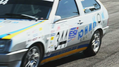 Racing cars pass the racing track tarmac with roaring sound