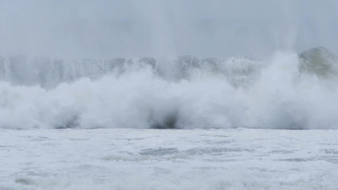 Massive sea swell waves braking on coast during storm El NiÃ±o