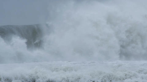 Massive waves crashing on rocks along coast during storm El NiÃ±o