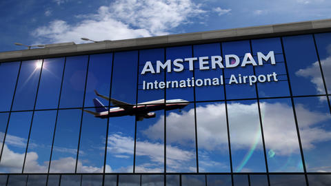 Airplane landing at Amsterdam mirrored in terminal