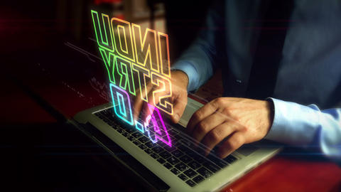 Man typing on keyboard with industry 4.0 hologram