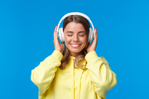 Music, lifestyle and youth concept. Close-up portrait of dreamy happy and