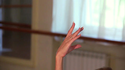 Close-up female dancer's hand hovering motionless in the air