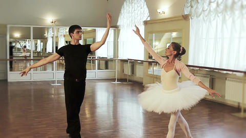 Ballet dancing in the studio, couple practicing dancing moves