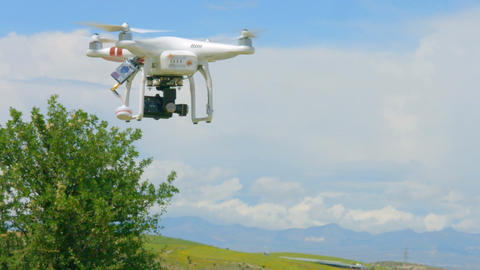 Modern drone flying in sky, professional video filming, innovation technology