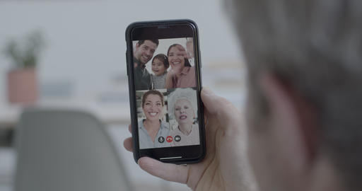 Family on video call at home during social distancing using smart phone and video conferencing