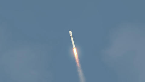 Commercial space rocket launch into space with exhaust flames and smoke 4k