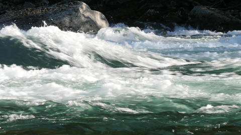 Slow motion of rapids, mountain river, foaming water